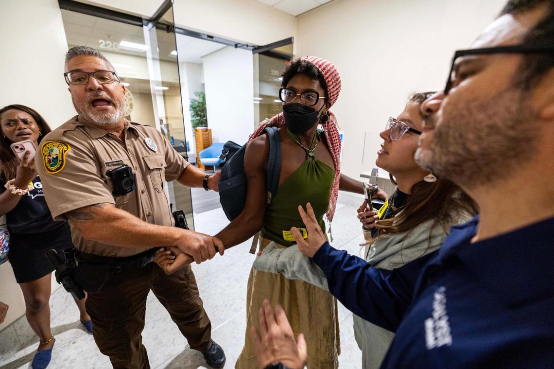 Z Spicer is arrested after being forcibly removed from the commission chambers by officers during a Miami-Dade County Commission meeting at the Stephen P. Clark Government Center on Thursday, June 26, 2025, in Miami.