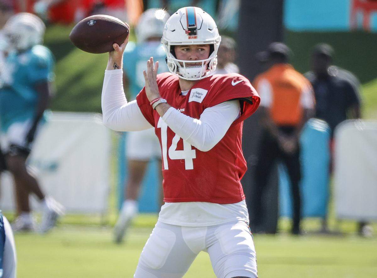 Miami Dolphins quarterback Quinn Ewers (14) sets up to pass during an NFL football joint practice with the Jacksonville Jaguars at the Miami Dolphins Training Camp.
