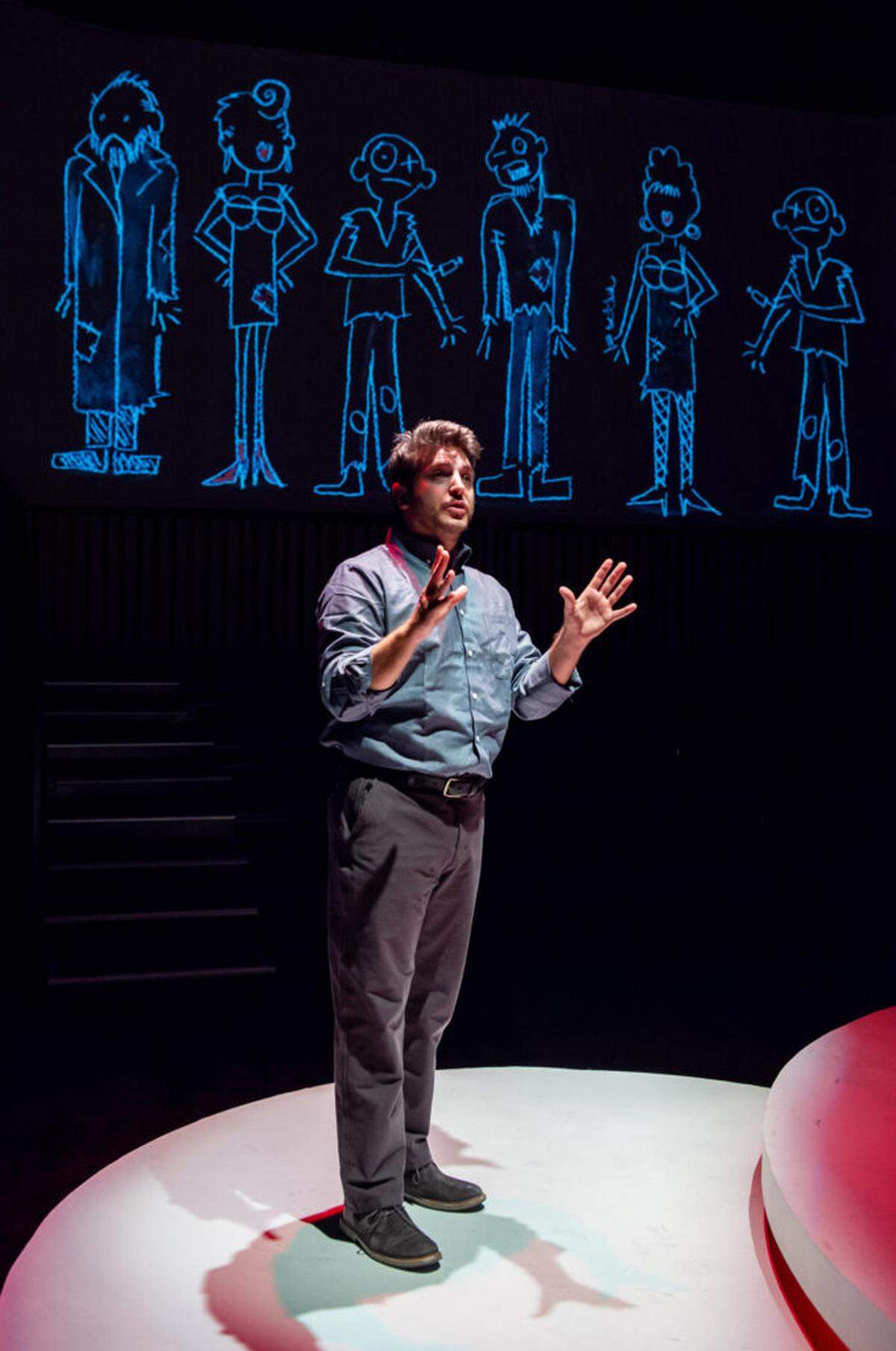 Ryan Didato as Katurian with the backdrop of Michael McKeever’s projected illustrations in Zoetic Stage’s “The Pillowman.”