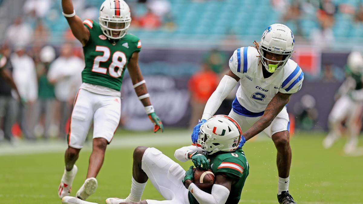 Miami Hurricanes safety James Williams (0) intercepted a pass intended for Central Connecticut State Blue Devils wide receiver Tyshaun James (2) during the third quarter of their ACC football game at Hard Rock Stadium on Saturday, September 25, 2021 in Miami Gardens, Florida.