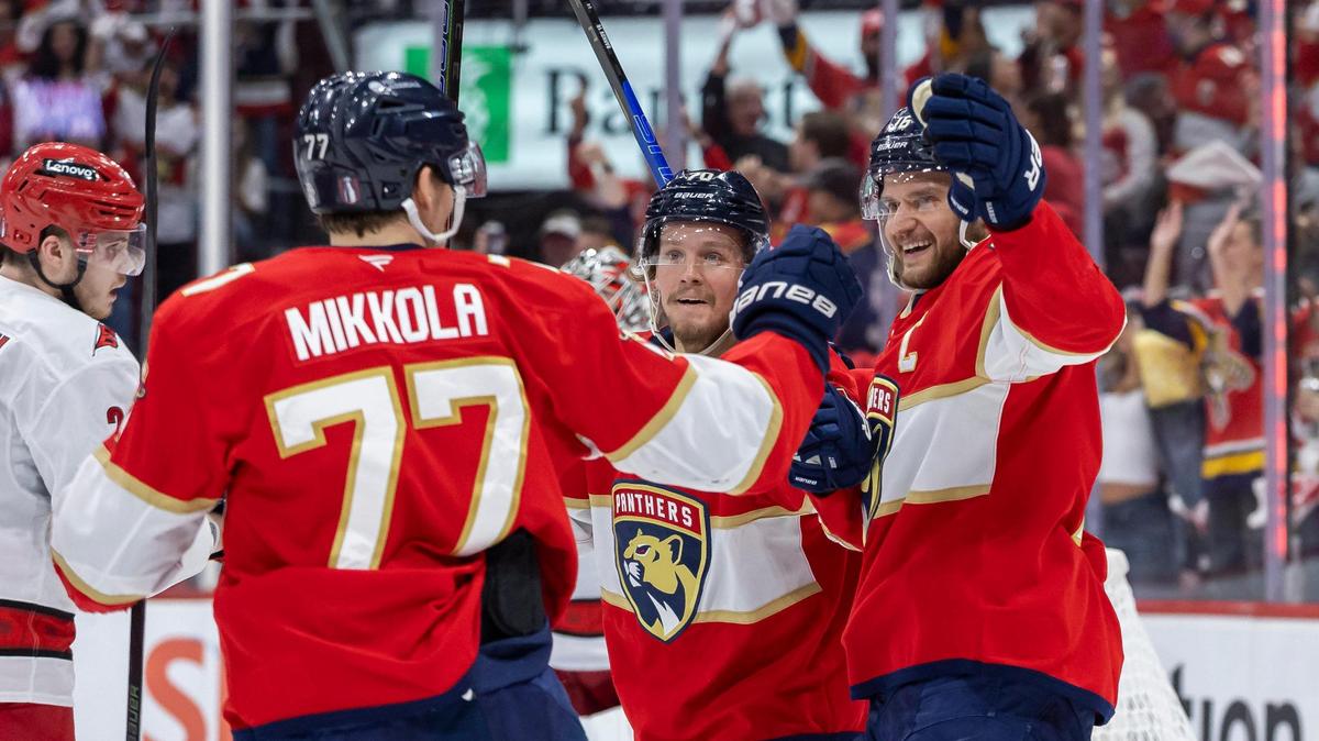 Florida Panthers defenseman Niko Mikkola (77) celebrates with his teammates after scoring against Carolina Hurricanes goaltender Pyotr Kochetkov (52) in the first period of Game 3 during the Eastern Conference final of the NHL Stanley Cup playoffs at Amerant Bank Arena on Saturday, May 24, 2025, in Sunrise, Fla.