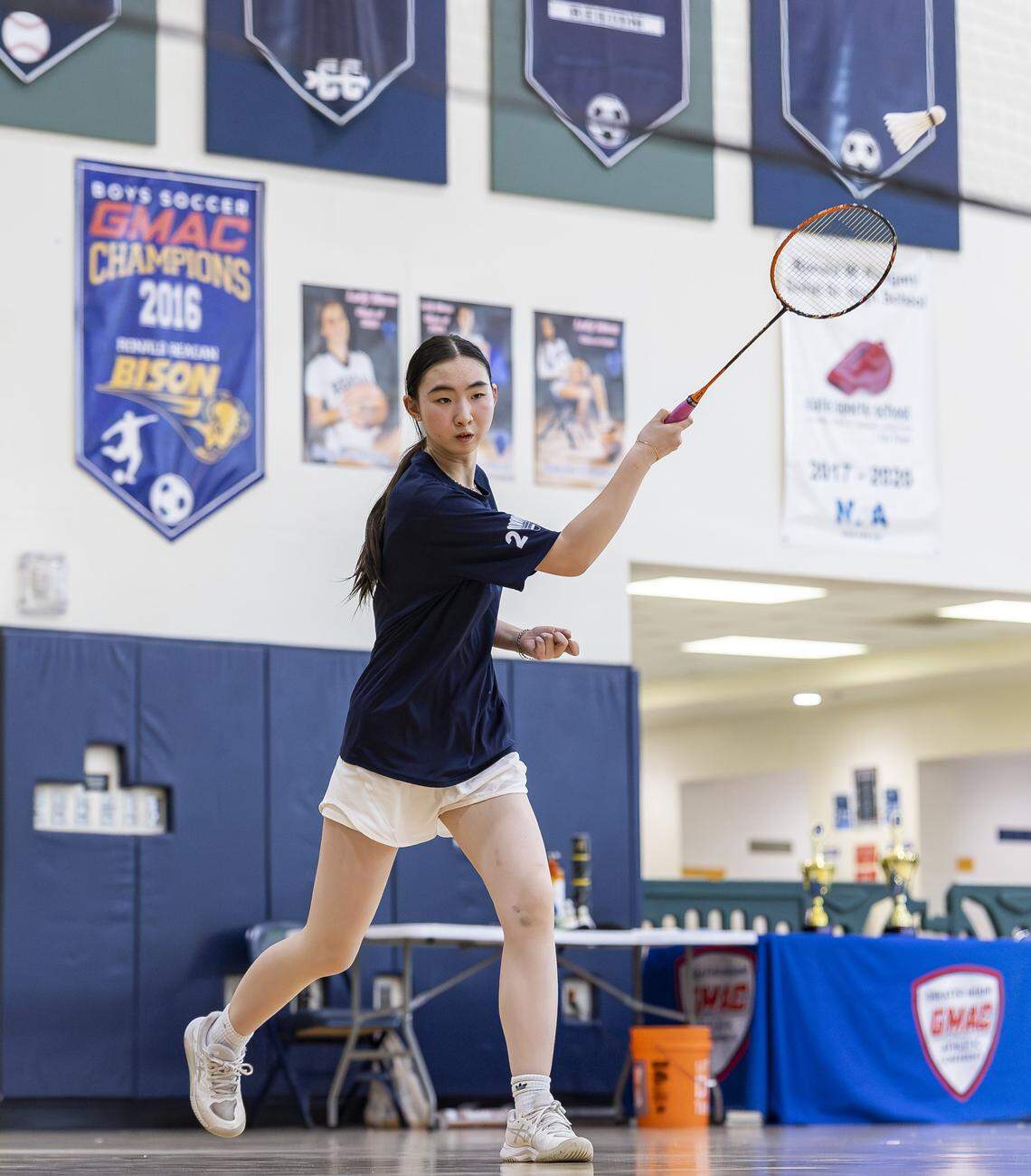 Miami Palmetto Senior High School student Kayla Mo returns a shot as she competes in the girls doubles GMAC badminton championship at Ronald W. Reagan Doral Senior High School on Wednesday, April 22, 2026, in Doral, Fla.