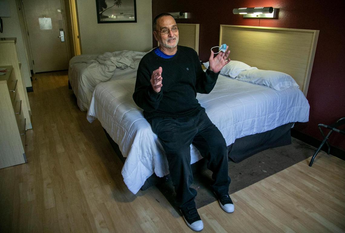 Miami, Florida, January 29, 2021 - Heriberto Delvalle talks in his hotel room in Miami after being released by immigration officials. The 70-year-old man born in Cuba has spent nearly half his life behind bars. Convicted of attempted murder after shooting the brother of a man he believed to be his wifes lover, Delvalle served 15 years in a Florida prison. He was released only to be taken straight into custody by immigration officials where he has been detained for over 11 years.