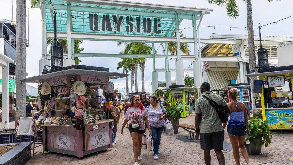 Tourists like these on Aug. 19, 2023 often visit Bayside Marketplace in downtown Miami to enjoy a variety of restaurants, cocktails, shops, panoramic views of the skyline and live music.