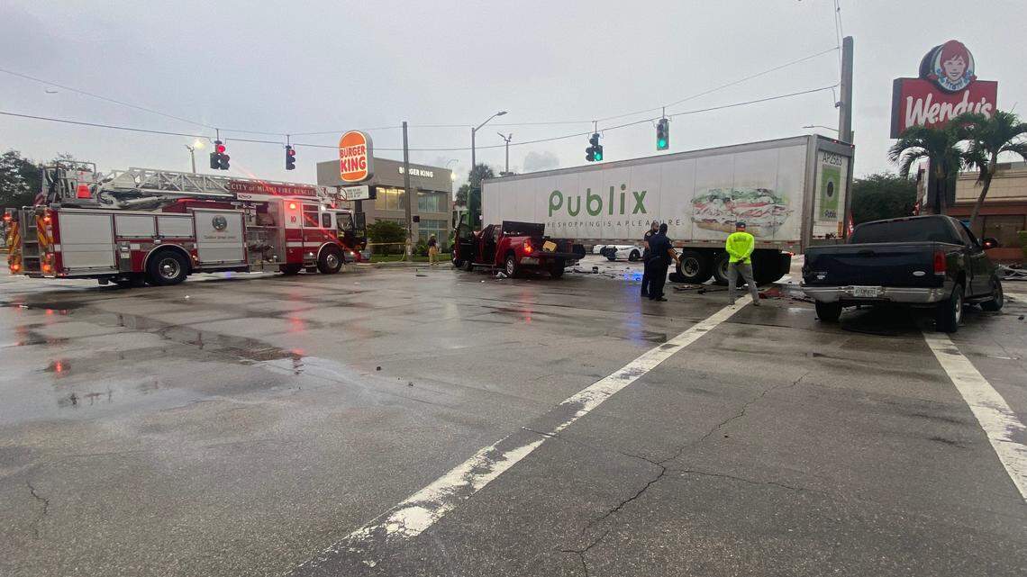 Three people were injured in a crash involving a Publix tractor trailer and two pick-up trucks early Friday in Miami, fire rescue said.