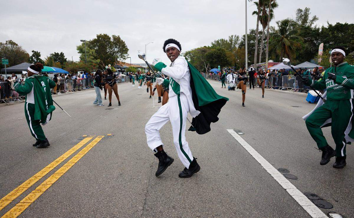 Trayvon Early, head drum major for Miami Central, center, leads the Miami Central High School band during the Dr. Martin Luther King Jr. Day parade on Monday, Jan. 20, 2025, in Liberty City in Miami, Fla.