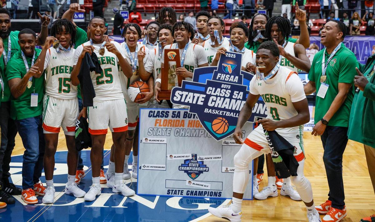 Blanche Ely Tigers celebrate on the court after defeating Ponte Vedra in the FHSAA Class 5A Final for Boys High School Basketball State Championship at the RP Funding Center in Lakeland, Florida on Friday, March 7, 2025.