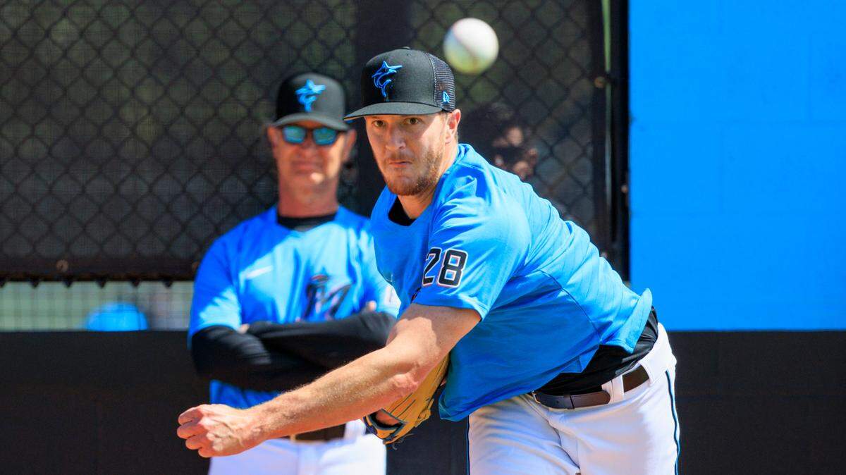 Miami Marlins manager Don Mattingly looks on as Marlins pitcher Trevor Rogers throws during the first full-squad spring training workout at Roger Dean Stadium on Monday, March 14, 2022 in Jupiter, FL.