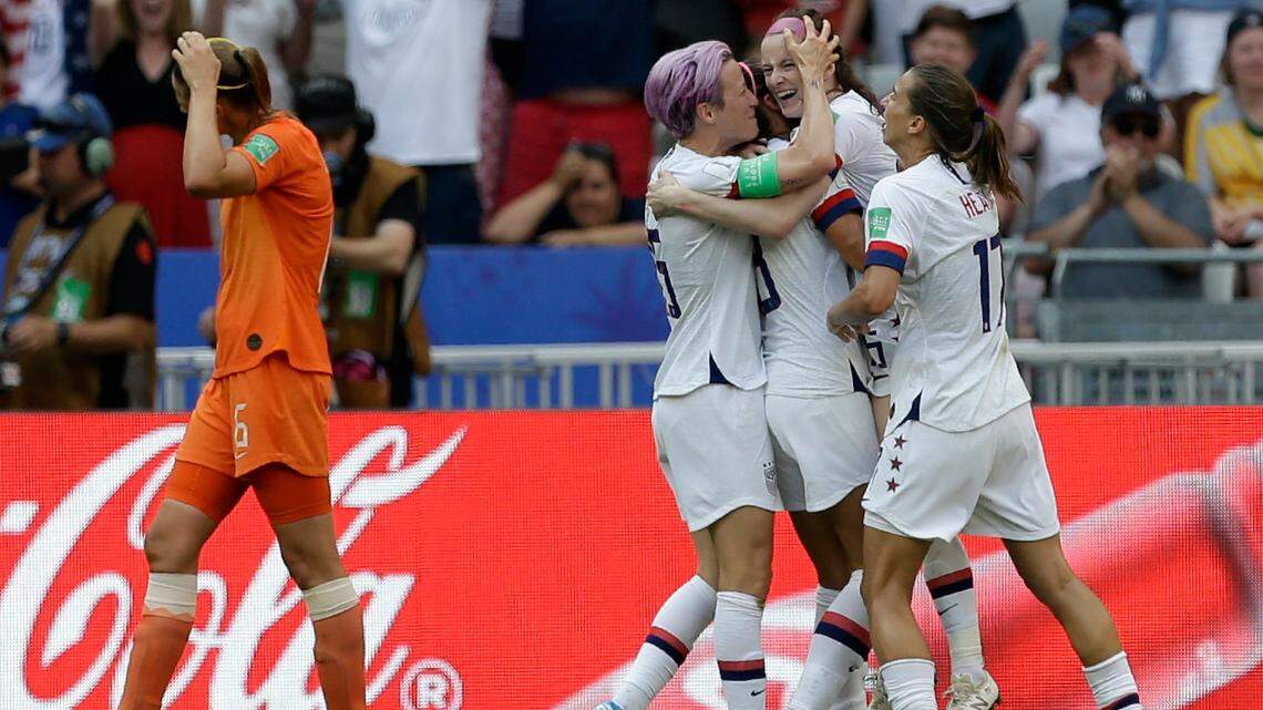 United States’ Rose Lavelle, second right, celebrates with Megan Rapinoe, center, after scoring her side’s second goal during the Women’s World Cup final soccer match between US and The Netherlands at the Stade de Lyon in Decines, outside Lyon, France, Sunday, July 7, 2019. (AP Photo/Claude Paris)