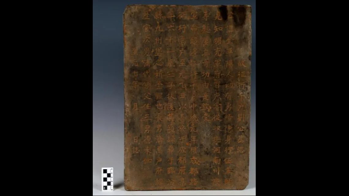 The tombstone tells the story of a commander who moved up the ranks of military service.