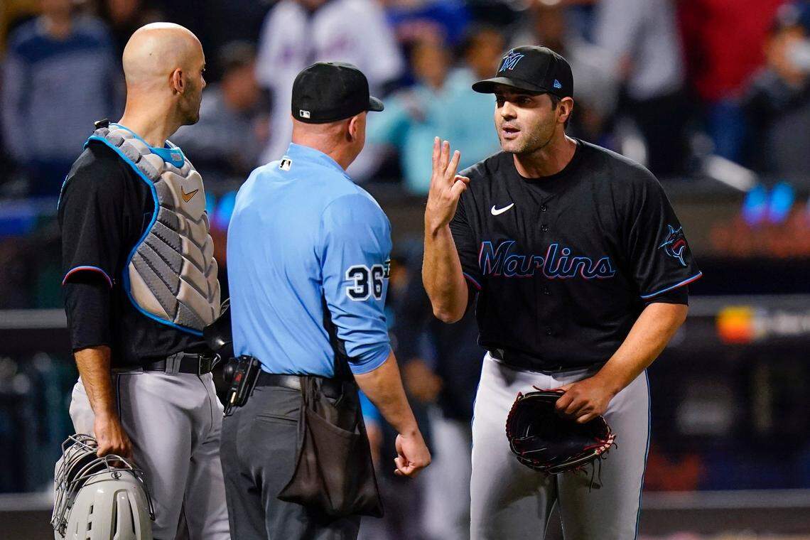 Miami Marlins relief pitcher Richard Bleier, right, argues with home plate umpire Ryan Blakney, center, after being ejected after the eighth inning of the team’s baseball game against the New York Mets on Tuesday, Sept. 27, 2022, in New York. The Marlins won 6-4. (AP Photo/Frank Franklin II)
