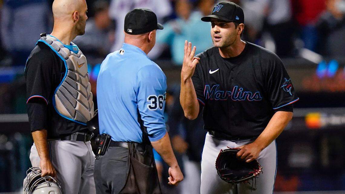 Miami Marlins relief pitcher Richard Bleier, right, argues with home plate umpire Ryan Blakney, center, after being ejected after the eighth inning of the team’s baseball game against the New York Mets on Tuesday, Sept. 27, 2022, in New York. The Marlins won 6-4. (AP Photo/Frank Franklin II)