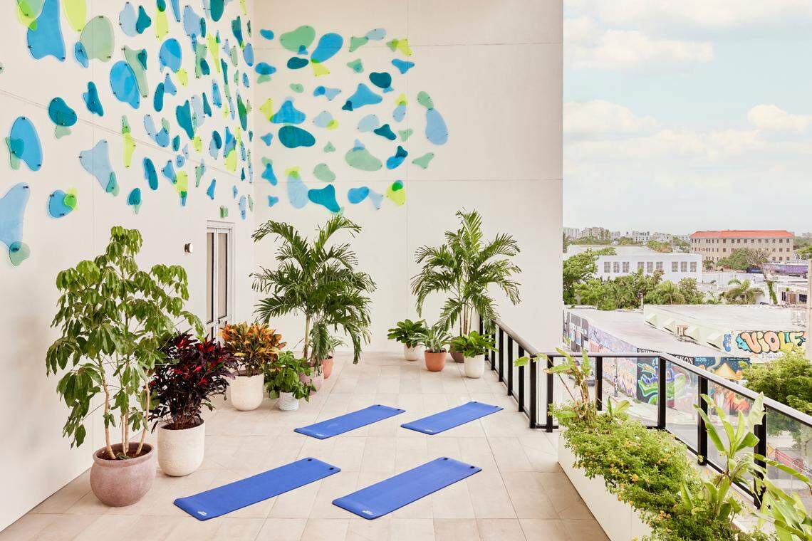 The yoga deck at Arlo Wynwood features a plexiglass mural from Florida-based artist Ari Robinson.