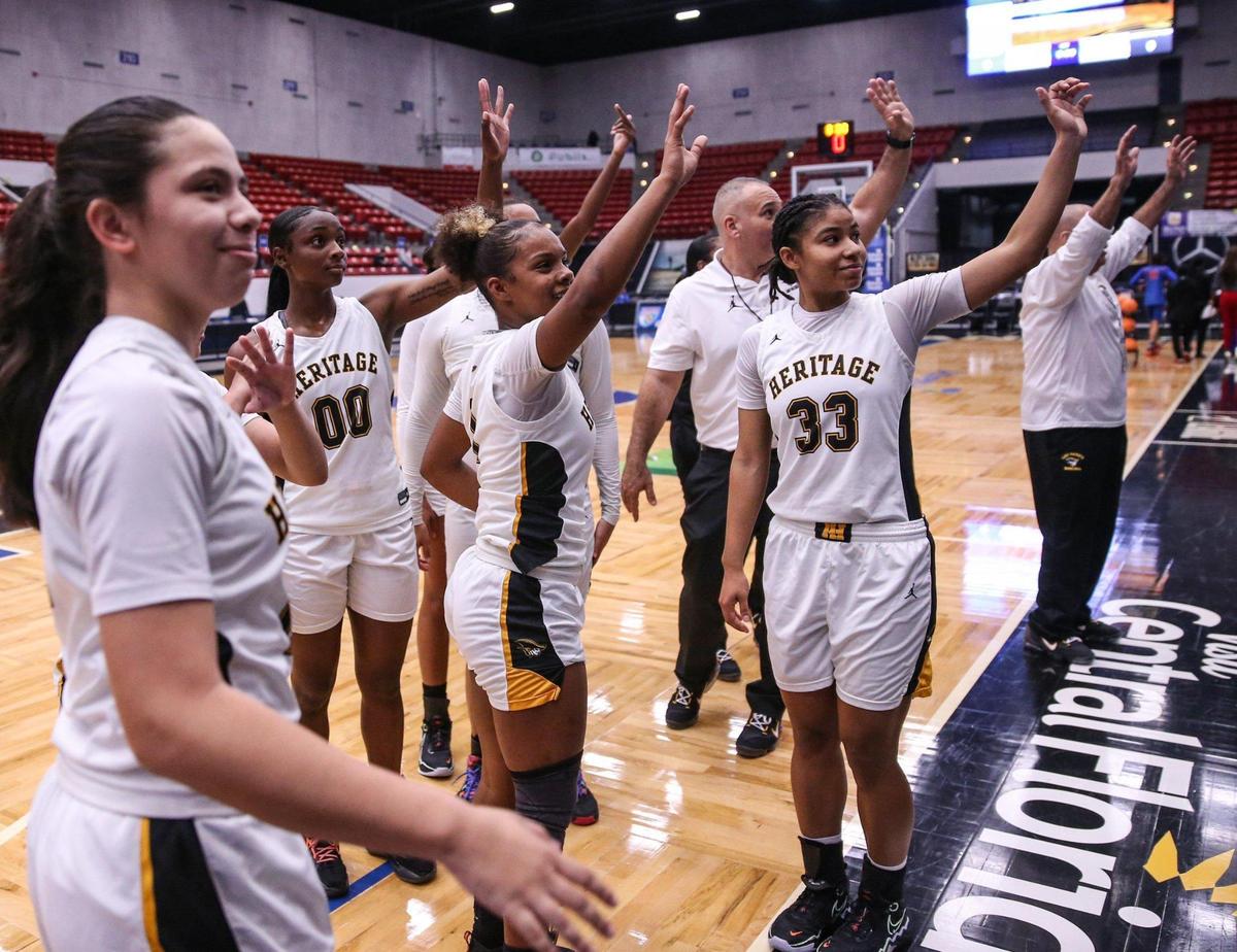 American Heritage players wave to supporters in the stands after defeating Pine Forest in a girls basketball Class 5A state semifinal at the RP Funding Center in Lakeland on Thursday, February 24, 2022.