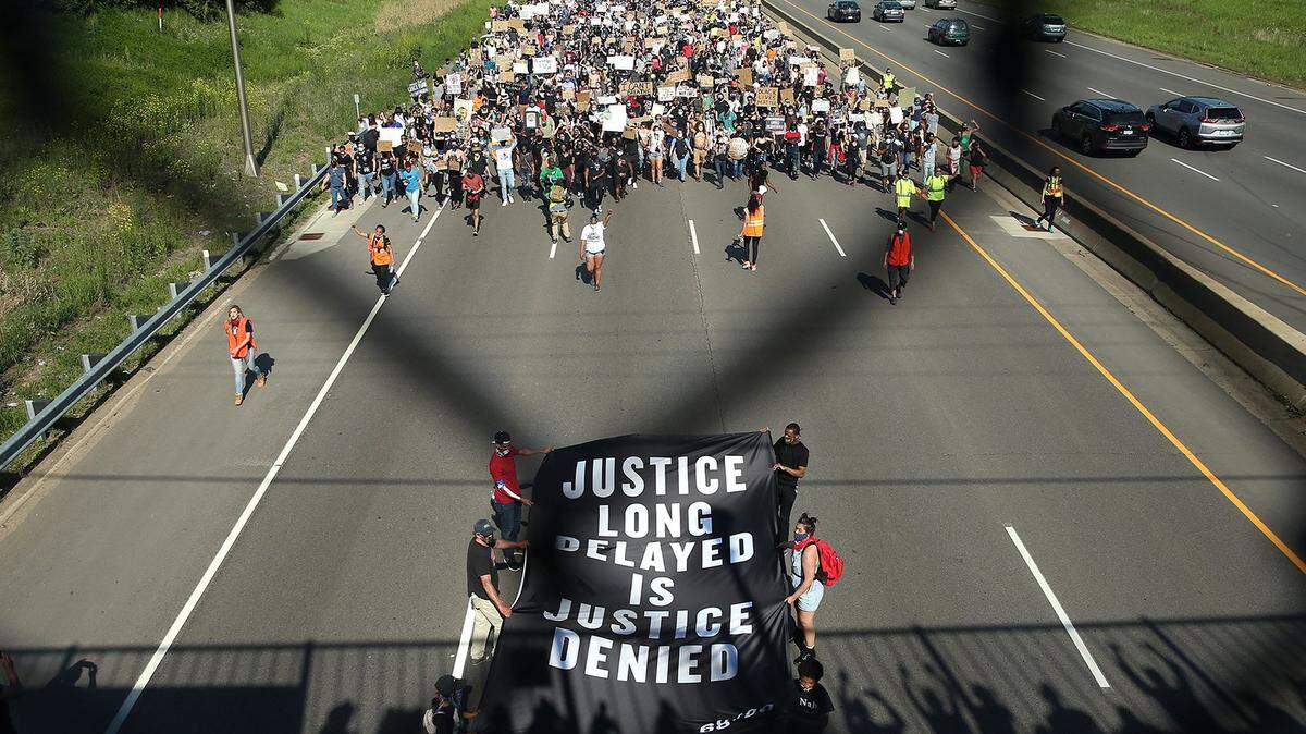 Demonstrators march on I- 35 while participating in a protest against police brutality and the death of George Floyd, on May 31, 2020, in St. Paul, Minnesota. Protests continue to be held in cities throughout the country over the death of George Floyd, a black man who died while in police custody in Minneapolis on May 25.
