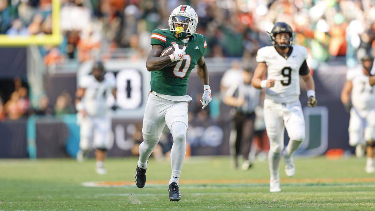 Miami Hurricanes defensive back Mishael Powell (0)scores on an interception against the Wake Forest Demon Deacons in the first half of their NCAA game in Miami Gardens, Florida, on Saturday, November 23, 2024.