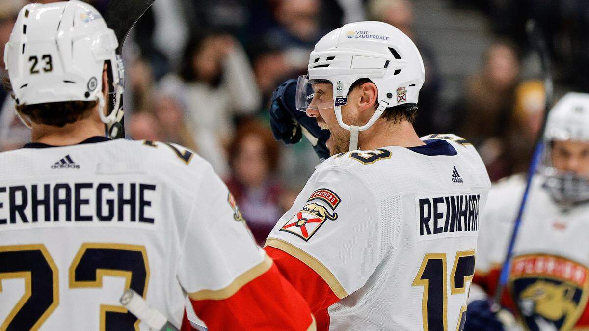 Jan 6, 2024; Denver, Colorado, USA; Florida Panthers center Sam Reinhart (13) celebrates with center Carter Verhaeghe (23) after his hat trick goal in the third period against the Colorado Avalanche at Ball Arena.