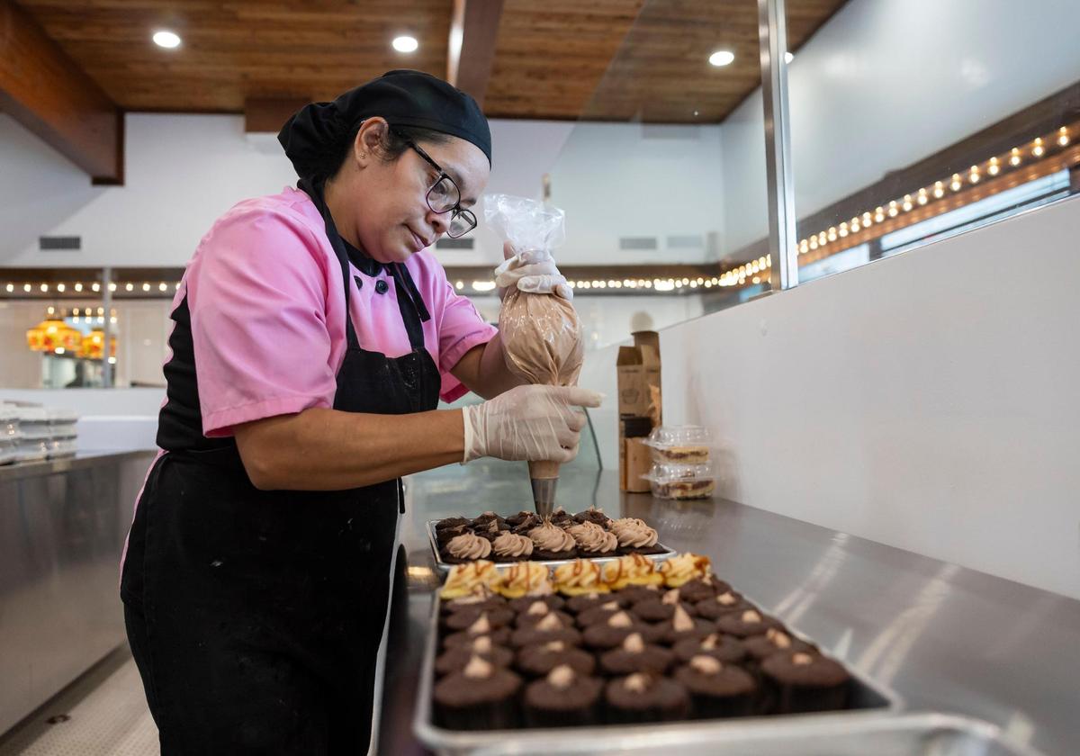Gabriela Jarquin, 39, frosts cupcakes at Misha’s Cupcakes in Coral Gables.