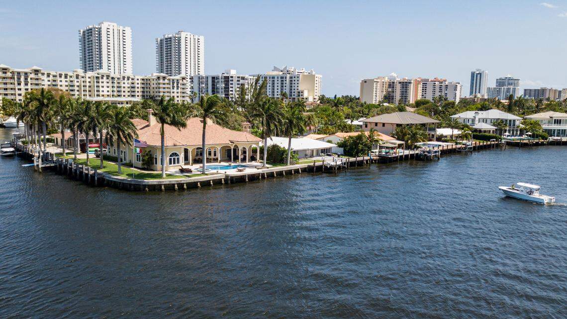 Miami-Dade and Broward counties experienced historic residential sales numbers. Above: An aerial view of single-family homes off Lake Santa Barbara in Pompano Beach, FL in April 2021.