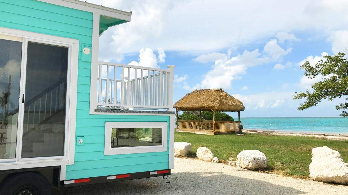 This tiny house is named “Hemingway,” after the legendary author who lived in Key West and whose former home is now a museum. It sleeps four and has a queen bed in a loft accessible by ladder.