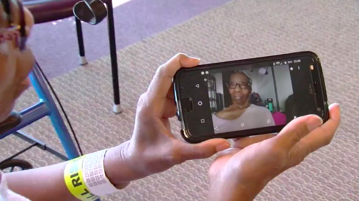 Juanita Branch shows one of the selfies on her phone.