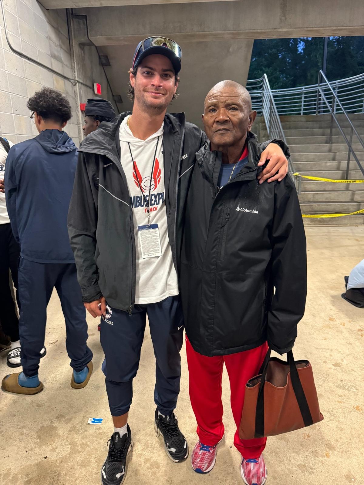 Columbus track coaches Danny Areces (left) and James Hardwick (right) were instrumental in leading the Explorers to their second consecutive state championship.