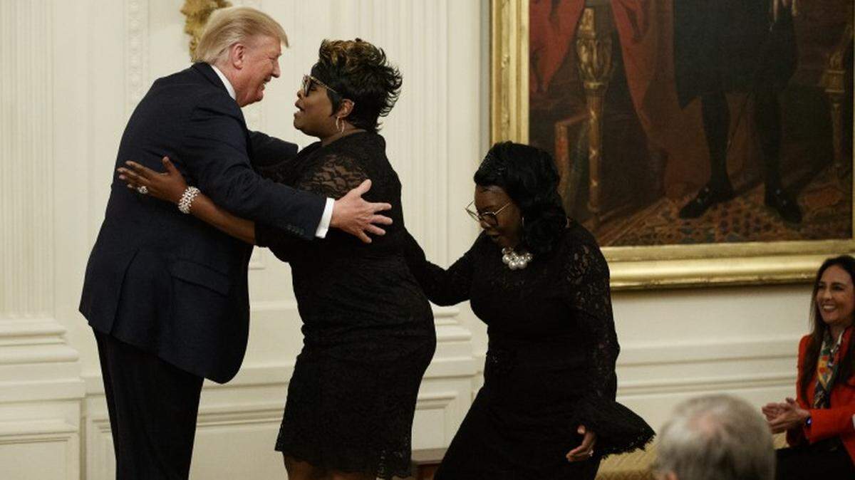 President Trump greets “Diamond and Silk” during his July 11 Presidential Social Media Summit in the East Room of the White House.