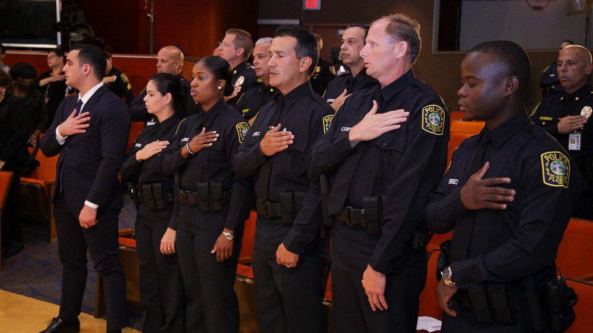 New police officers, at a swearing-in ceremony, who will serve in Miami-Dade County Public Schools.