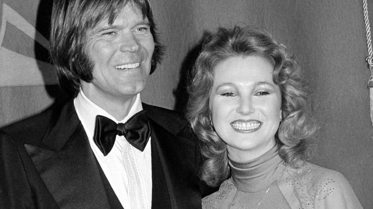 In this Feb. 15, 1979 file photo, country singers Glen Campbell, left, and Tanya Tucker, engaged to one another, are shown at the Grammy Awards in Los Angeles.
