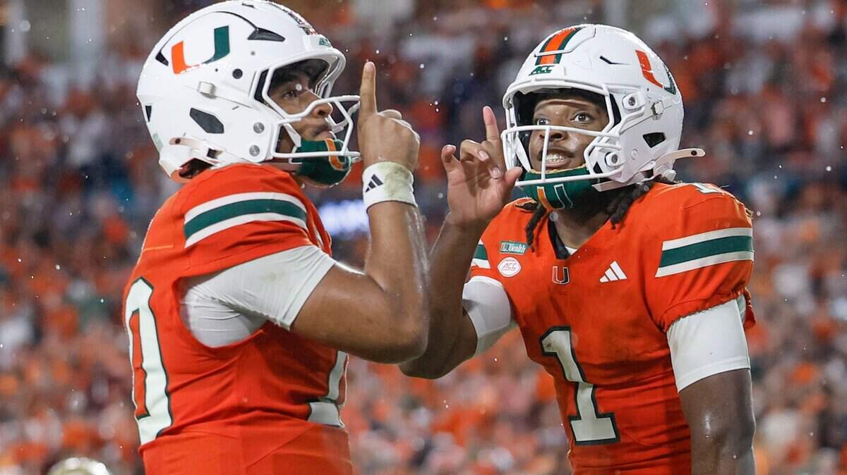 Miami Hurricanes quarterback Darian Mensah (10) and Miami Hurricanes wide receiver Malachi Toney (1) celebrate in the endzone after Toney scores in the first half against the Florida State Seminoles at Hard Rock Stdium in Miami Gardens, Florida, on Saturday, October 17, 2026.