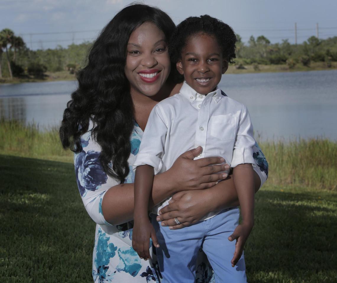 Destinie Baker Sutton and her son, Grant Sutton, in their backyard at their home in West Palm Beach.