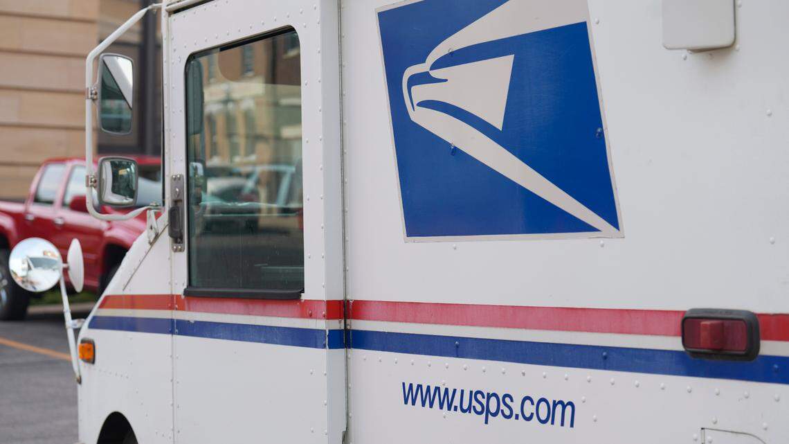 A U.S. Postal Service employee stole checks from the mail and tried fleeing the country, federal prosecutors say.