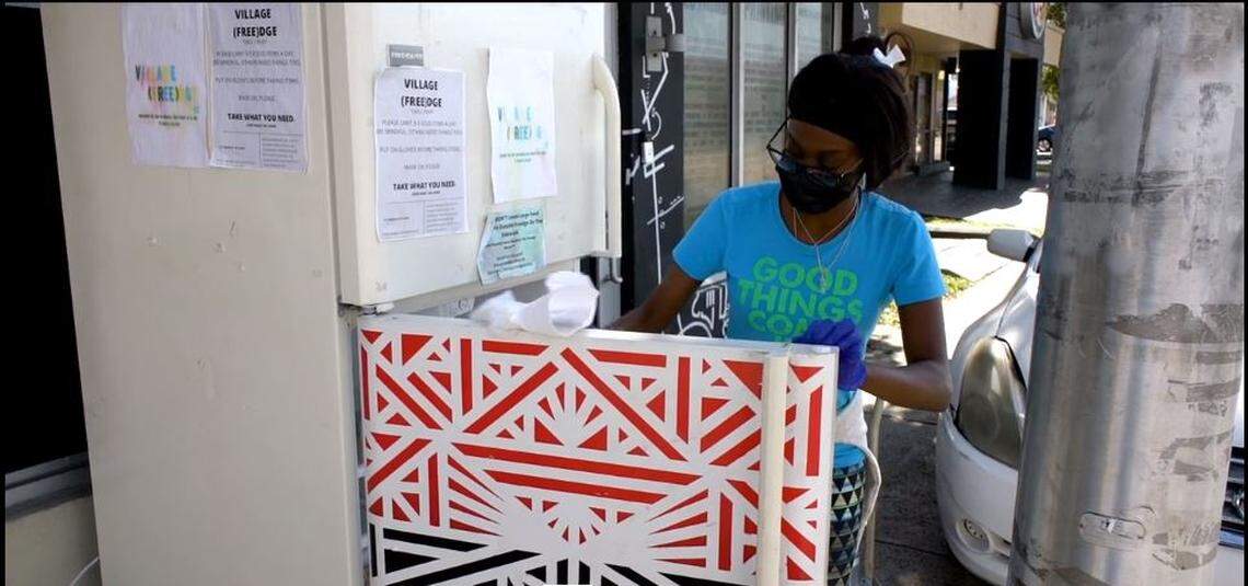 Sherina Jones cleans the Liberty City community refrigerator in a scene from the short film ‘The Village (Free)dge.’
