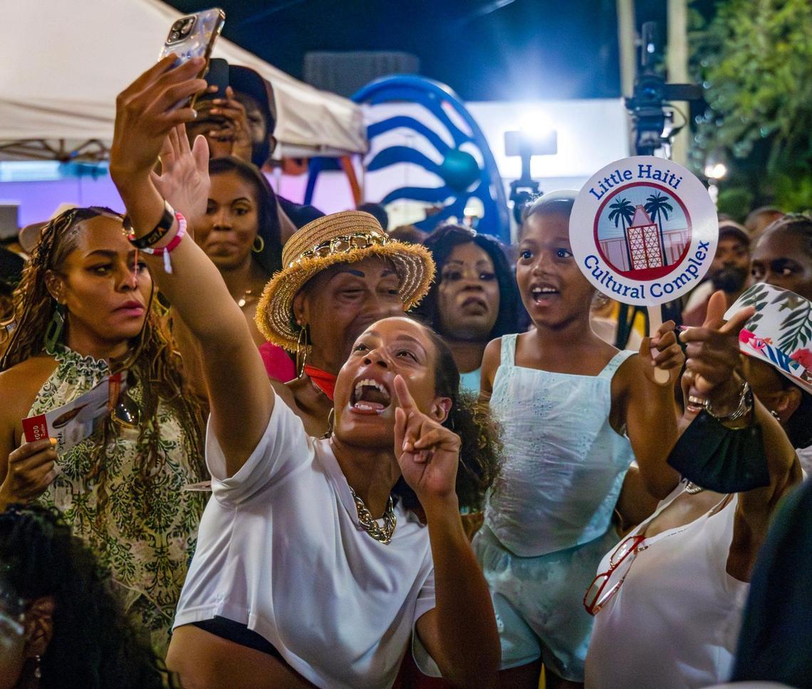A fan takes a quick photo among friends as Haitian konpa star Richard Cave performed with his band KAI and delivered another electrifying performance on Friday, June 20, 2025, at “Sounds of Little Haiti” in Miami, Florida.