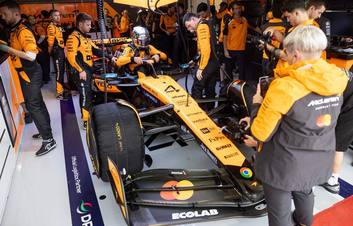 McLaren driver Lando Norris of Britain enters the cockpit of his car before the start of his Sprint race on the second day of the Formula One Miami Grand Prix at the Miami International Autodrome on Saturday, May 3, 2025, in Miami Gardens, Fla.