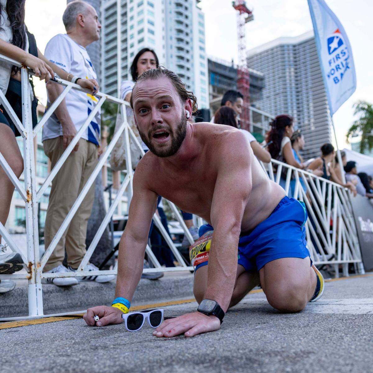 A runner reacts after crossing the finish line during the 2025 Lexus Corporate Run on Thursday, April 24, 2025, in Miami, Fla. Over 18,00 runners participated in the 5K race’s 40th anniversary in Downtown Miami.