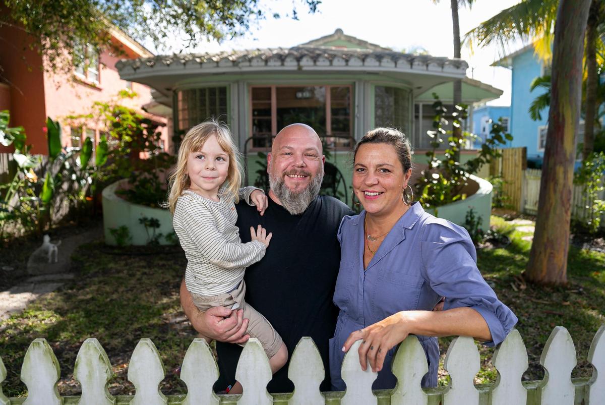 Anthony Nunziata, Carolina Penafiel and their son, Santino Nunziata-Penafiel, 4, stand outside of their rental home in Hollywood, Florida, on Saturday, Feb. 12, 2022. Nunziata is looking to purchase a home in Miami, however, high market prices for real estate are making his search difficult.