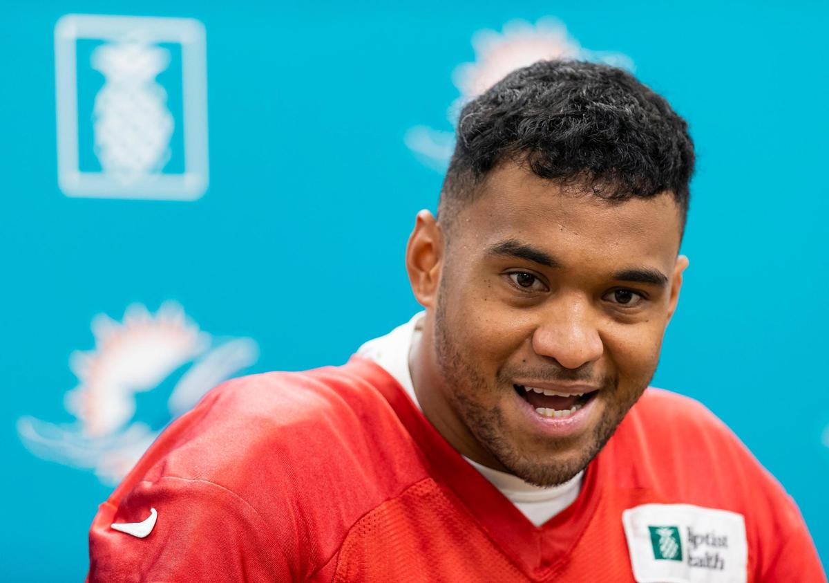 Miami Dolphins quarterback Tua Tagovailoa (1) speaks to reporters before team practice at the Baptist Health Training Complex on Wednesday, Oct. 19, 2022, in Miami Gardens, Fla.