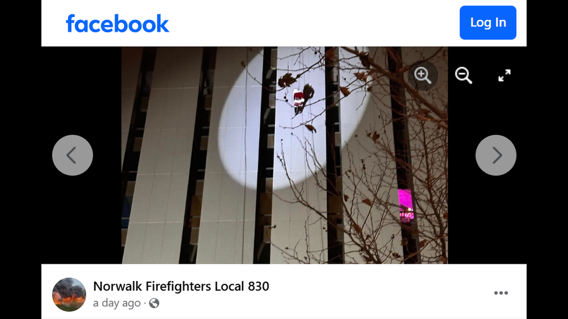 A man in a Santa costume was rescued from the side of a building, Connecticut firefighters said.