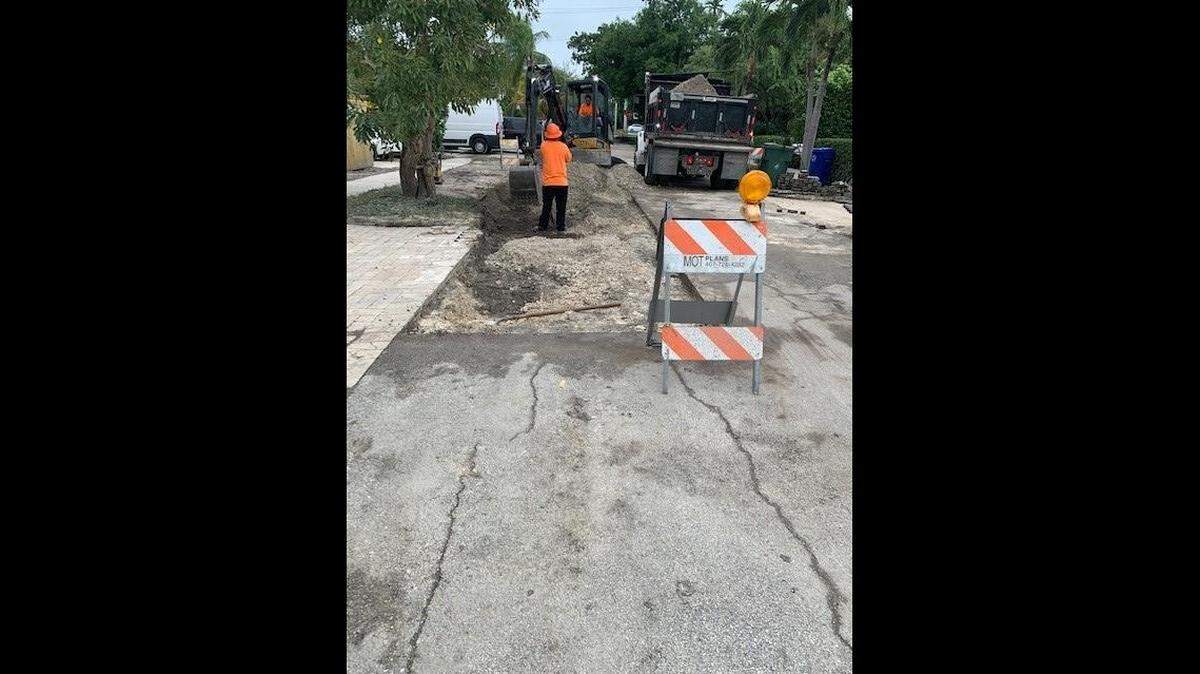 Repair crews work on Northeast Fifth Street Monday