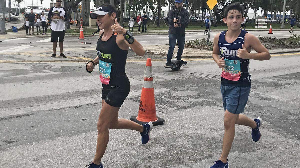 Caryn Lubetsky and her son, Davis, run the 2018 Miami Marathon.
