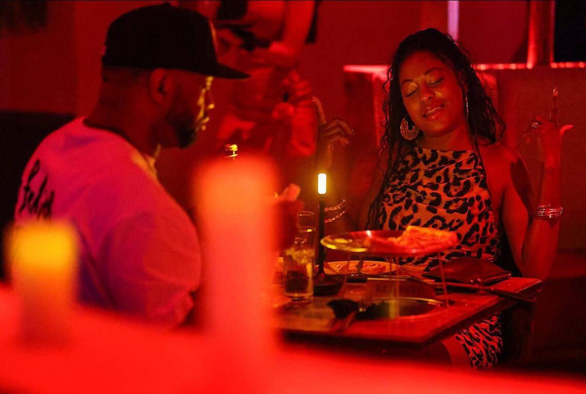 A couple enjoys the intimate ambiance during dinner while grooving to “mikeflo” spinning at Bargean in Little Havana, Miami, Florida, on Sunday, April 5, 2026.Kyle Hoto Reid, founder of the Love Languages event, hosts a party focused on intimacy and low-key aesthetics at Bargean in Little Havana, Miami, Florida on Sunday, April 5, 2026, that brought guests of diverse backgrounds to enjoy cocktails, dinner, and music by “mikeflo,” who spun old-school hip-hop, R&B, and contemporary tracks in Miami, Florida.
