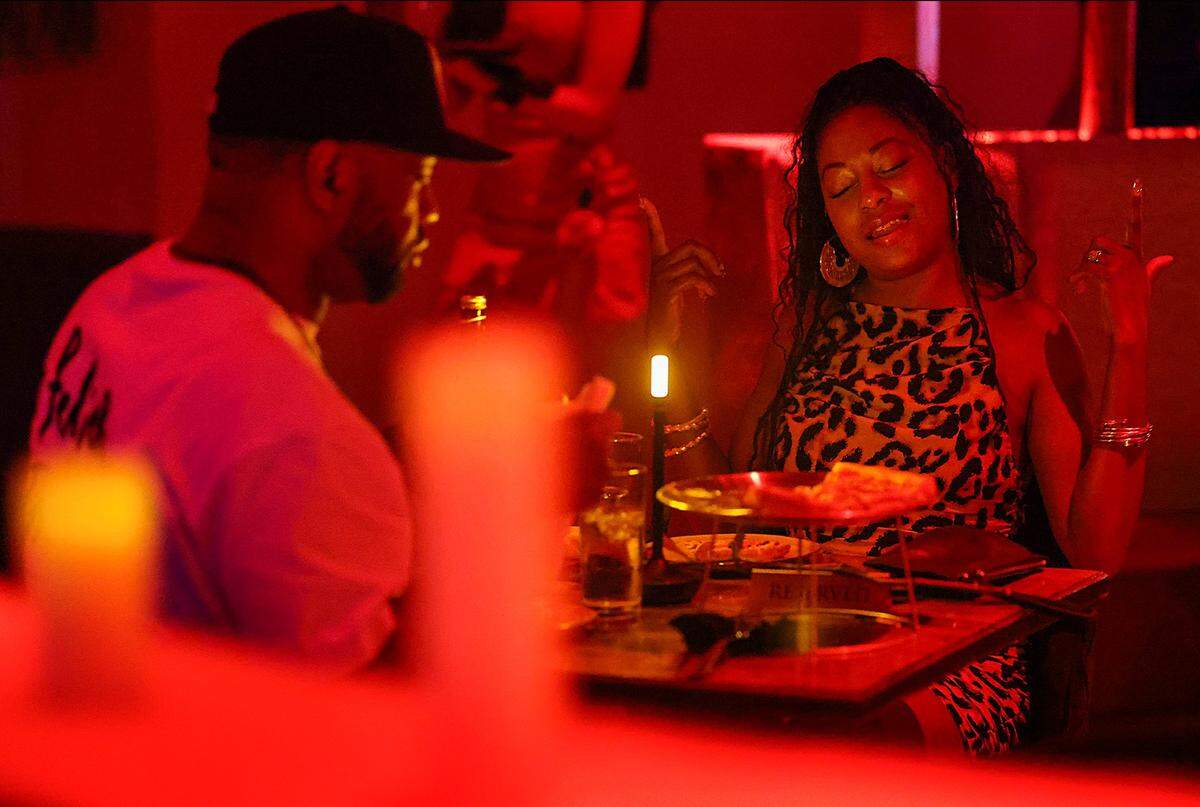 A couple enjoys the intimate ambiance during dinner while grooving to “mikeflo” spinning at Bargean in Little Havana, Miami, Florida, on Sunday, April 5, 2026.Kyle Hoto Reid, founder of the Love Languages event, hosts a party focused on intimacy and low-key aesthetics at Bargean in Little Havana, Miami, Florida on Sunday, April 5, 2026, that brought guests of diverse backgrounds to enjoy cocktails, dinner, and music by “mikeflo,” who spun old-school hip-hop, R&B, and contemporary tracks in Miami, Florida.