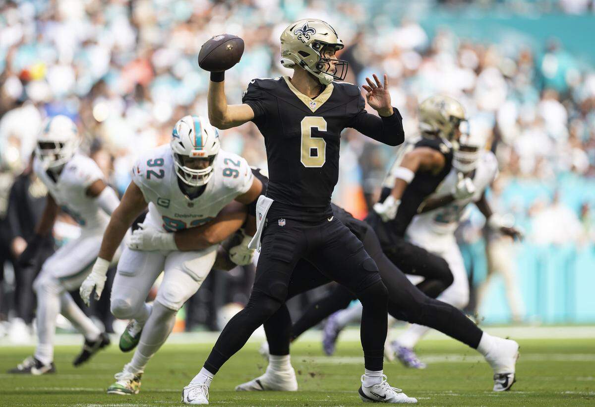 New Orleans Saints quarterback Tyler Shough (6) throws the ball against the Miami Dolphins in the first half of their NFL game at Hard Rock Stadium on Sunday, Nov. 30, 2025, in Miami Gardens, Fla.