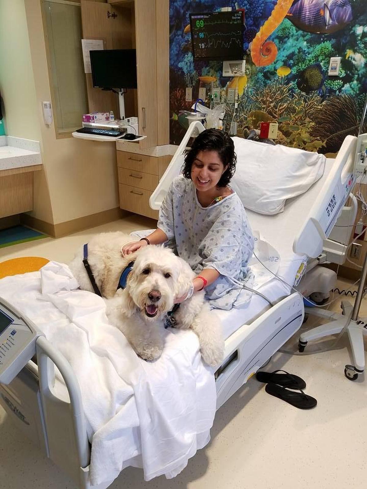  Sarita Moreno, 21, was treated for leukemia as a child at Salah Foundation Children’s Hospital, part of Broward Health. During treatment, she was inspired to become a nurse herself and is now a nursing student at Florida Atlantic University. Sarita with Louie the therapy dog as a teen patient.