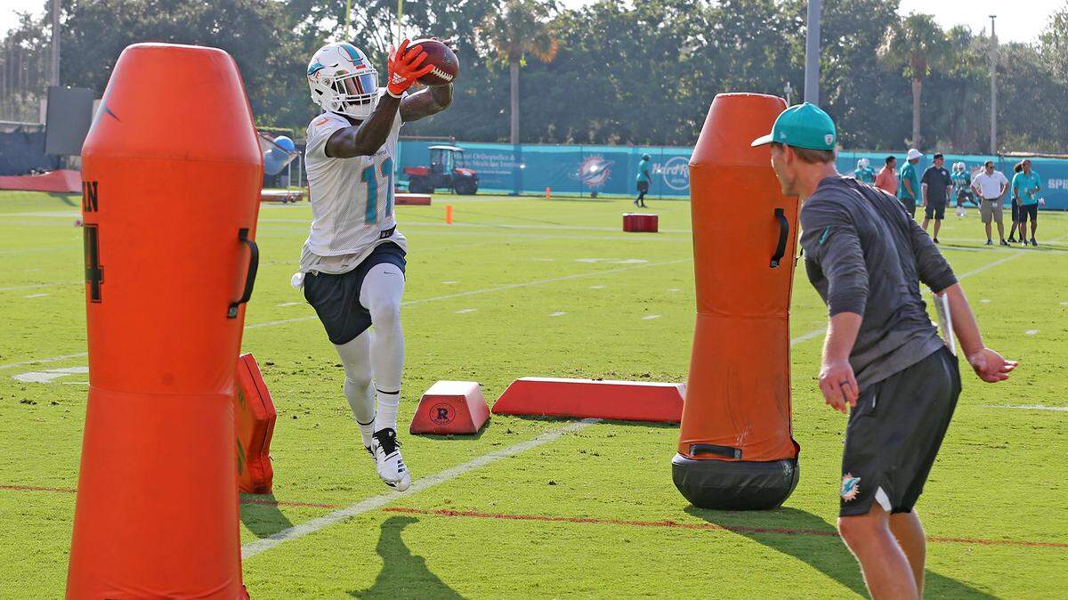 Miami Dolphins wide receiver DeVante Parker catches a pass during a drill on the first day of training camp at  Miami Dolphins training facility in Davie, Florida, July 26, 2018. 