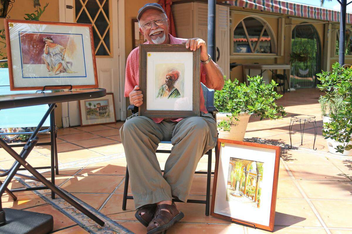 Cuban actor and painter Manolo Villaverde, 83, photographed with one of his paintings outside his home in Coral Gables, Florida, on Saturday, July 27, 2019.