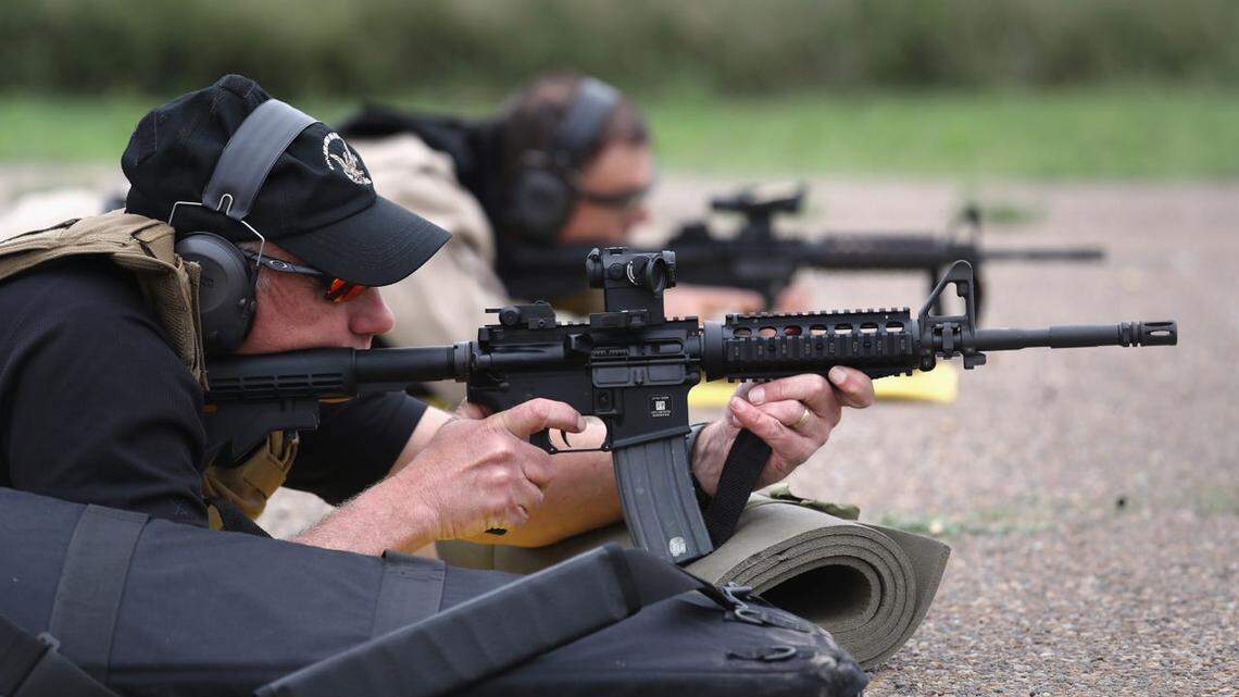 Customs and Border Protection agents fire M4 rifles during a qualification test.
