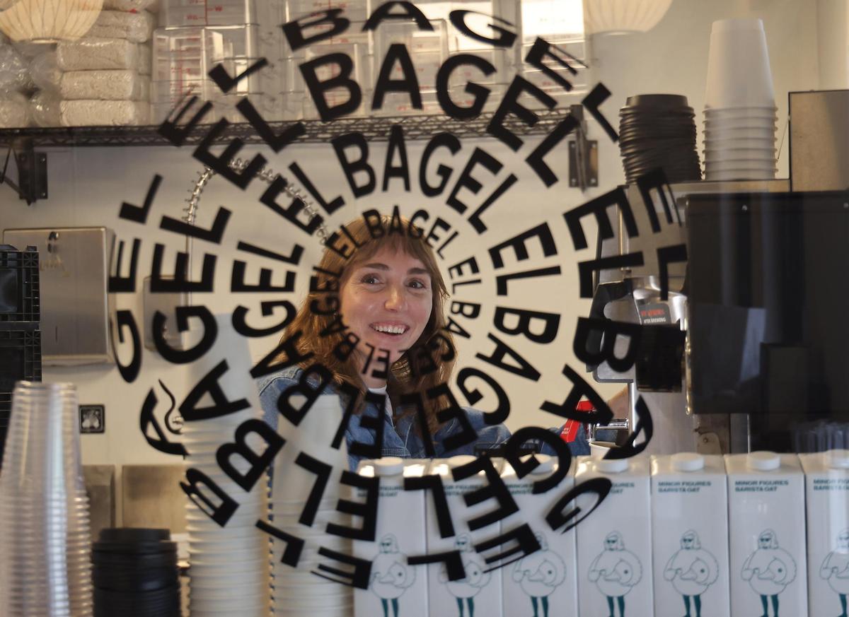 General manager Kelly McNamee, 28, talks with employees at the new El Bagel in Coconut Grove as the staff preps for normal operations.