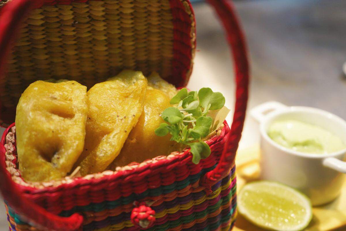 Ecuadorian-style green plantain empanadas stuffed with cheese are on the menu. We are glad about this.